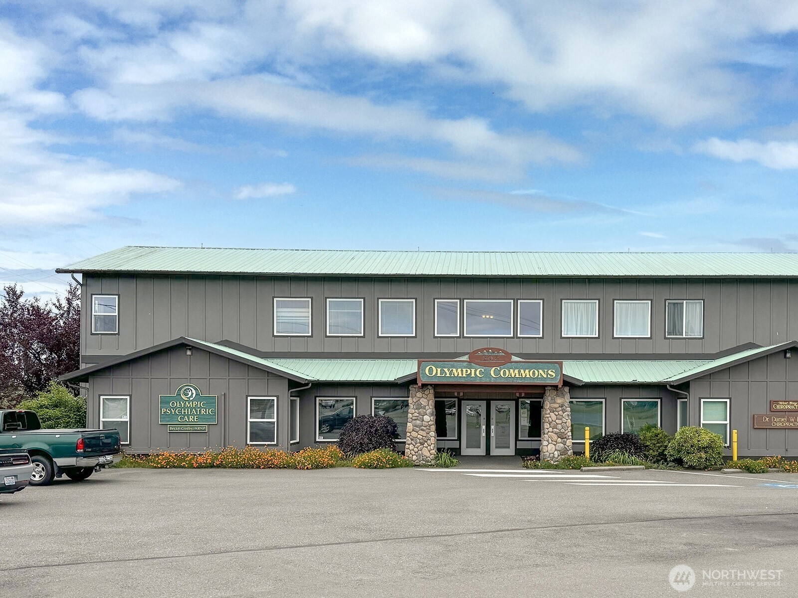 502 South Still Road, Unit 201 Sequim, WA 98382 - Photo 2 of 13 a front view of a building with street
