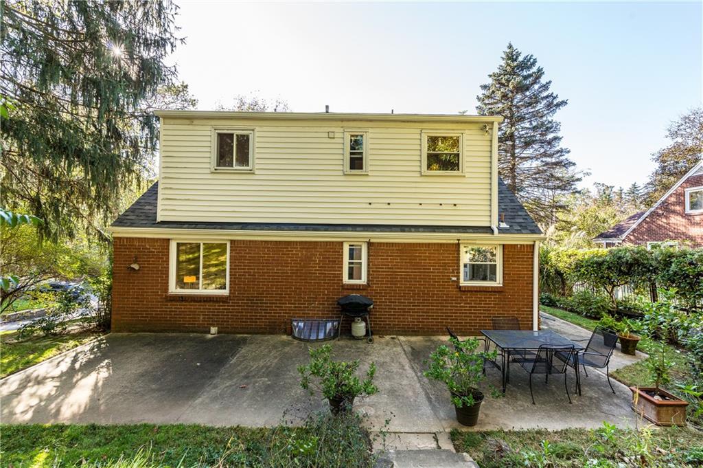 224 Rockingham Road Pittsburgh, PA 15238 - Photo 18 of 25 Large concrete patio spans width of house.