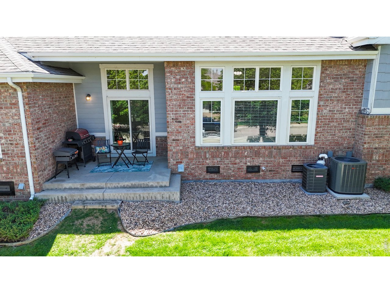 4672 West 20th Road, Unit 413 Greeley, CO 80634 - Photo 35 of 37 a view of front door of house with outdoor seating