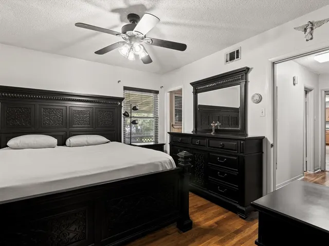 a bedroom with a bed and a television