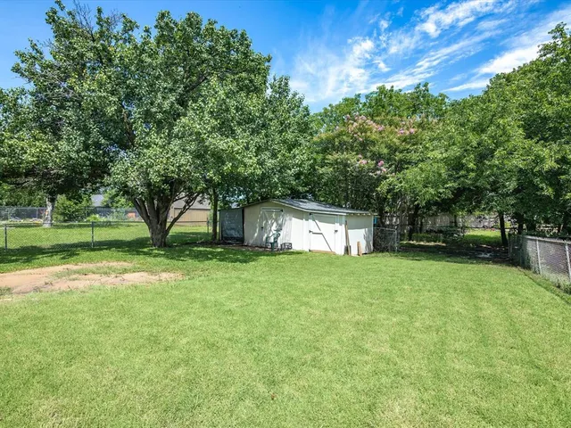 a view of backyard with green space