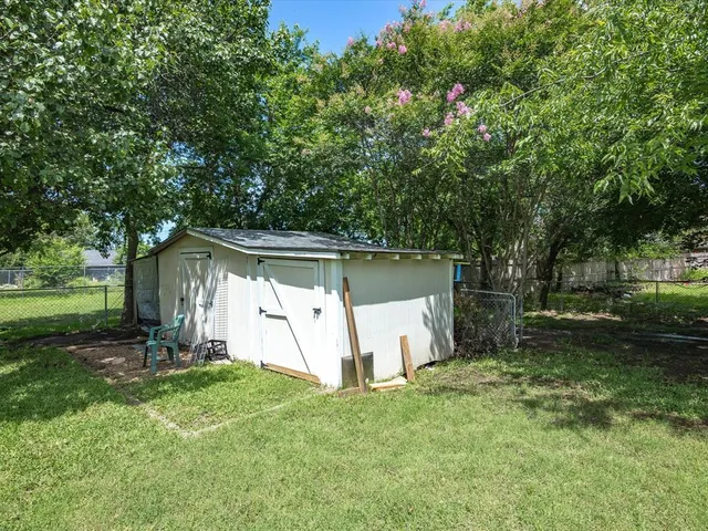 a front view of house with yard and outdoor seating