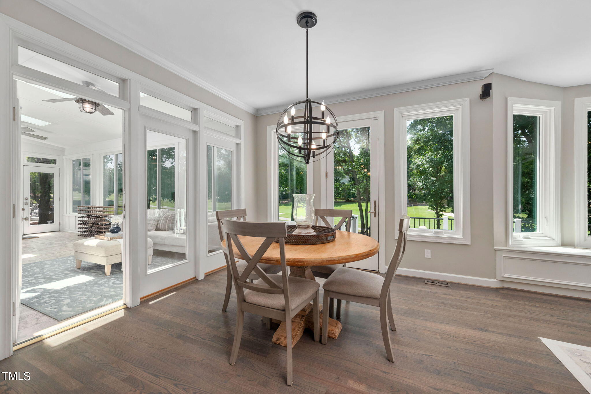 300 Pond Bluff Way Cary, NC 27513 - Photo 15 of 73 a dining room with furniture large windows and a chandelier