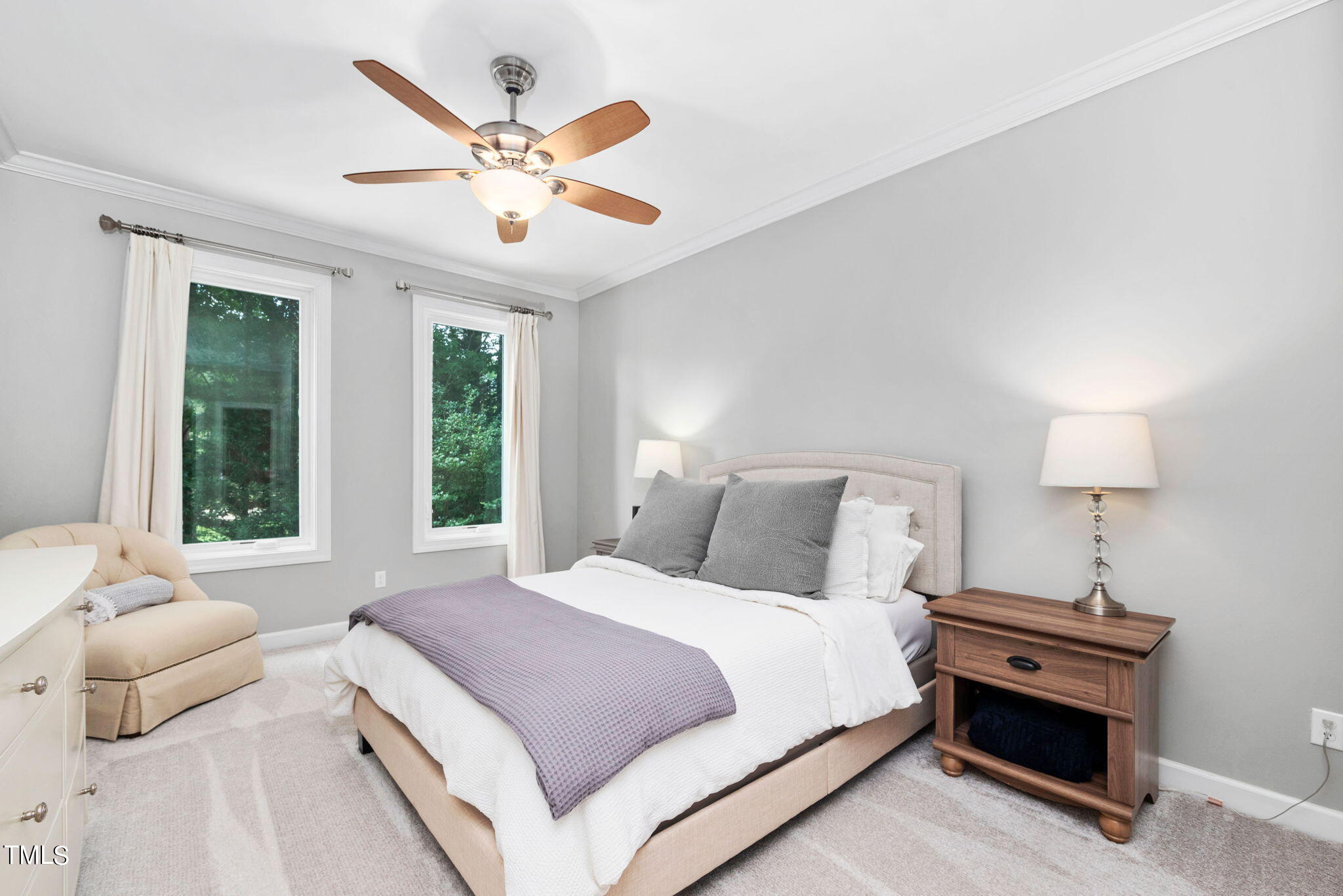 300 Pond Bluff Way Cary, NC 27513 - Photo 16 of 73 a bedroom with a large bed and a chandelier