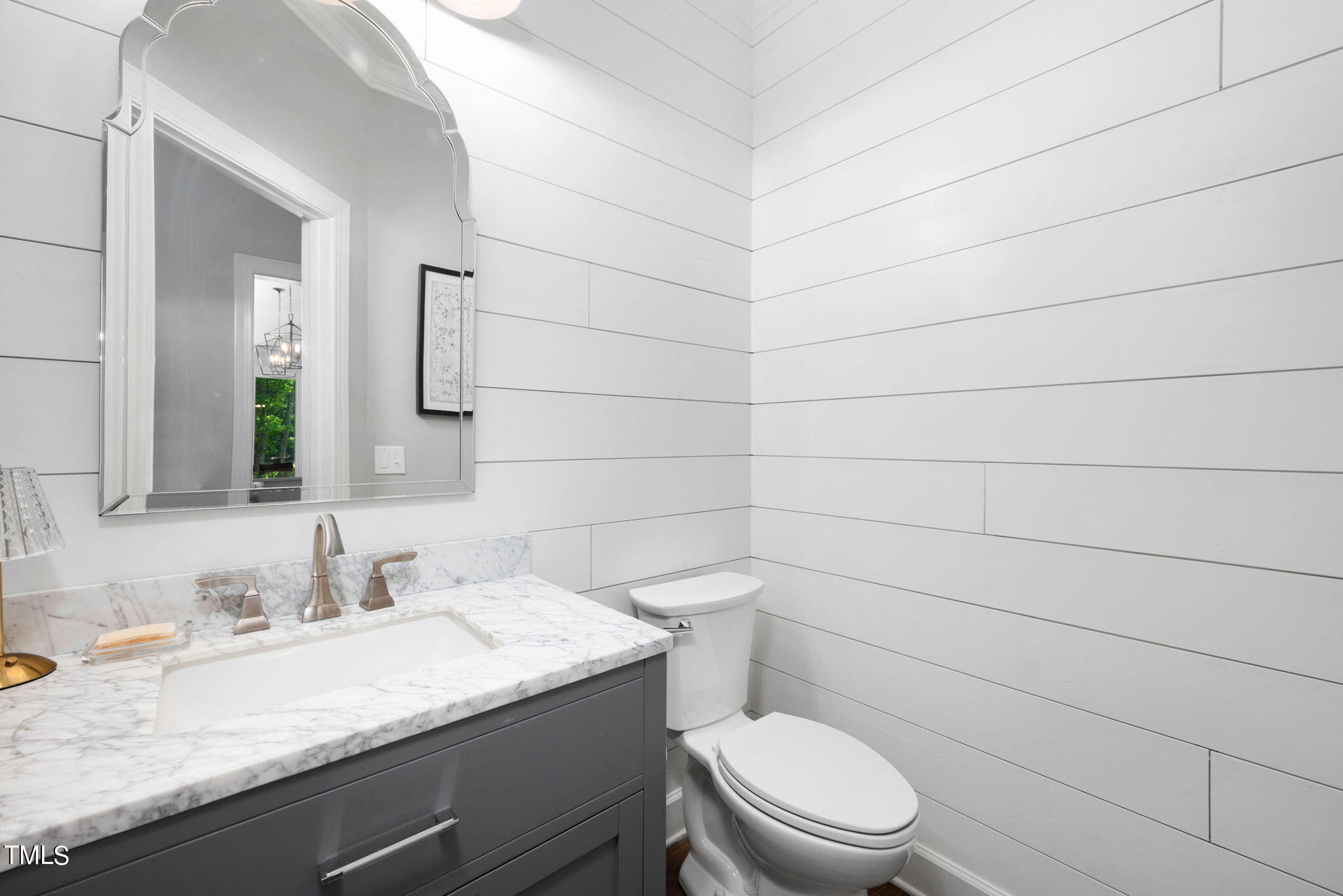 300 Pond Bluff Way Cary, NC 27513 - Photo 22 of 73 a bathroom with a granite countertop toilet sink and mirror