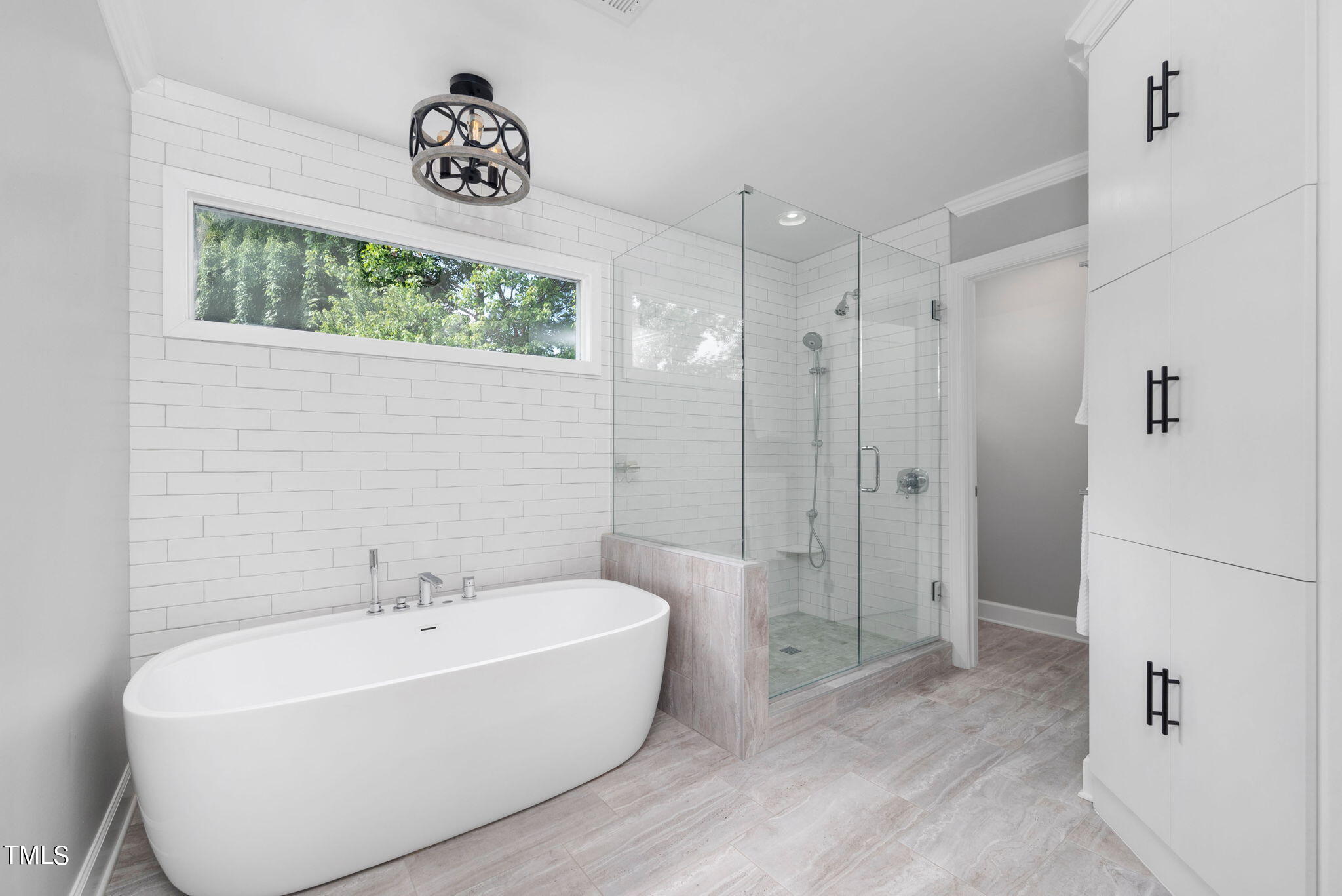 300 Pond Bluff Way Cary, NC 27513 - Photo 26 of 73 a bathroom with a bathtub and a shower