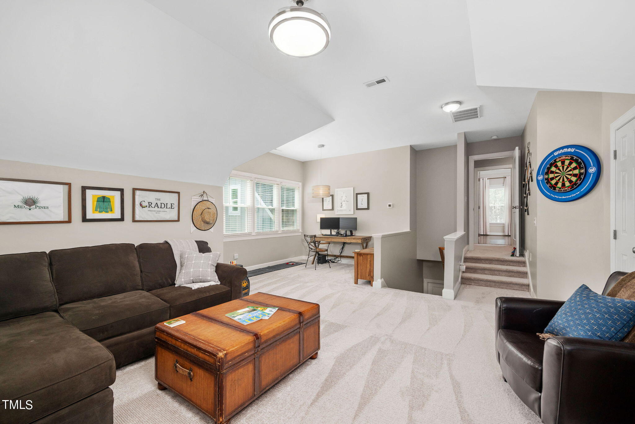 300 Pond Bluff Way Cary, NC 27513 - Photo 37 of 73 a living room with furniture and a wooden floor