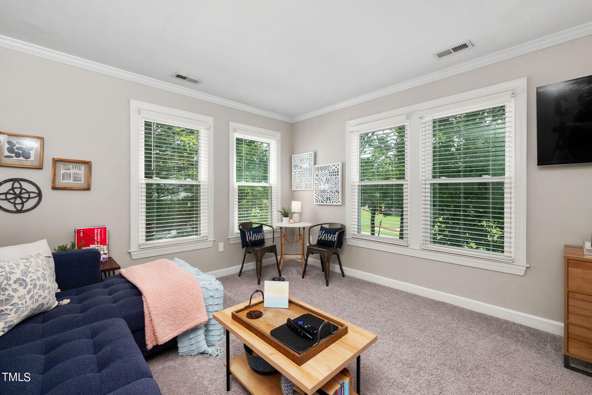 300 Pond Bluff Way Cary, NC 27513 - Photo 41 of 73 a living room with furniture and large windows