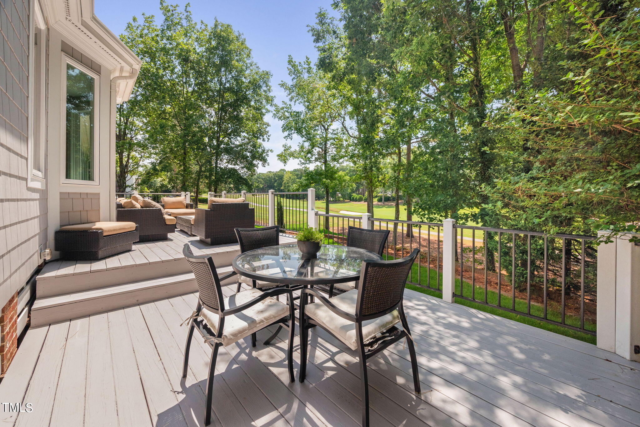 300 Pond Bluff Way Cary, NC 27513 - Photo 48 of 73 a view of a patio with table and chairs and potted plants