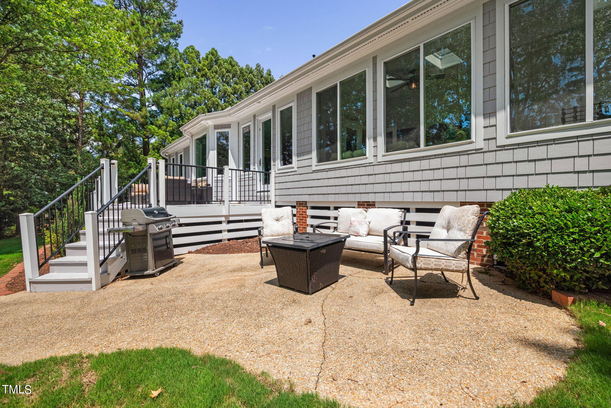 300 Pond Bluff Way Cary, NC 27513 - Photo 51 of 73 a view of a patio with a chairs and table in a patio