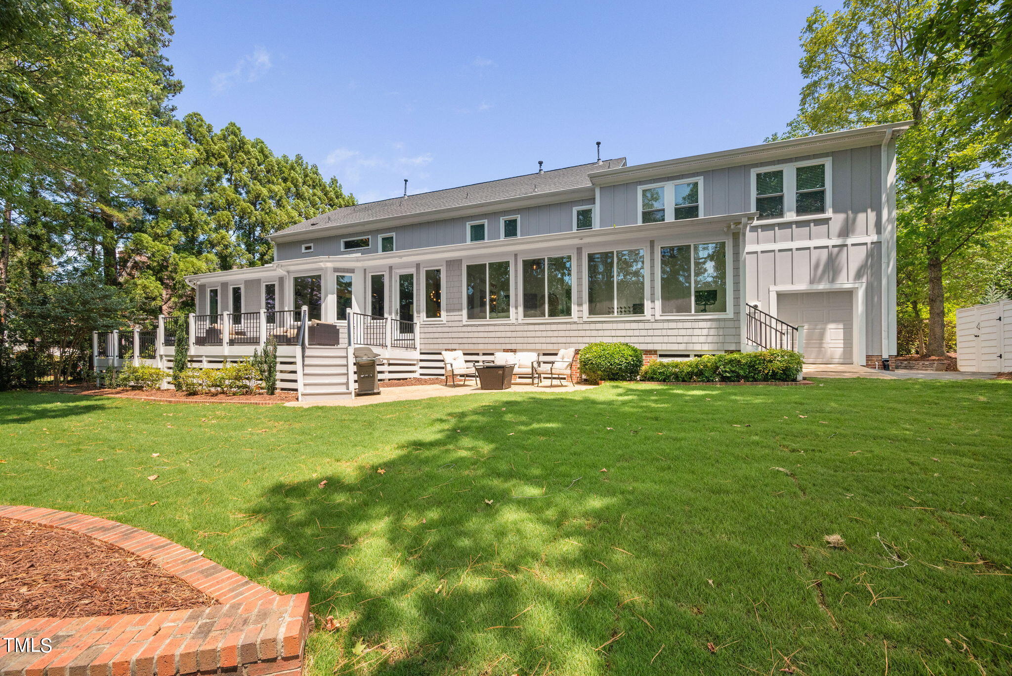 300 Pond Bluff Way Cary, NC 27513 - Photo 54 of 73 a front view of a house with a yard table and chairs