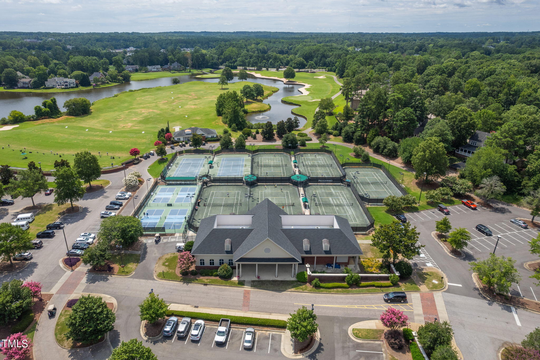 300 Pond Bluff Way Cary, NC 27513 - Photo 68 of 73 an aerial view of a house with garden space and lake view