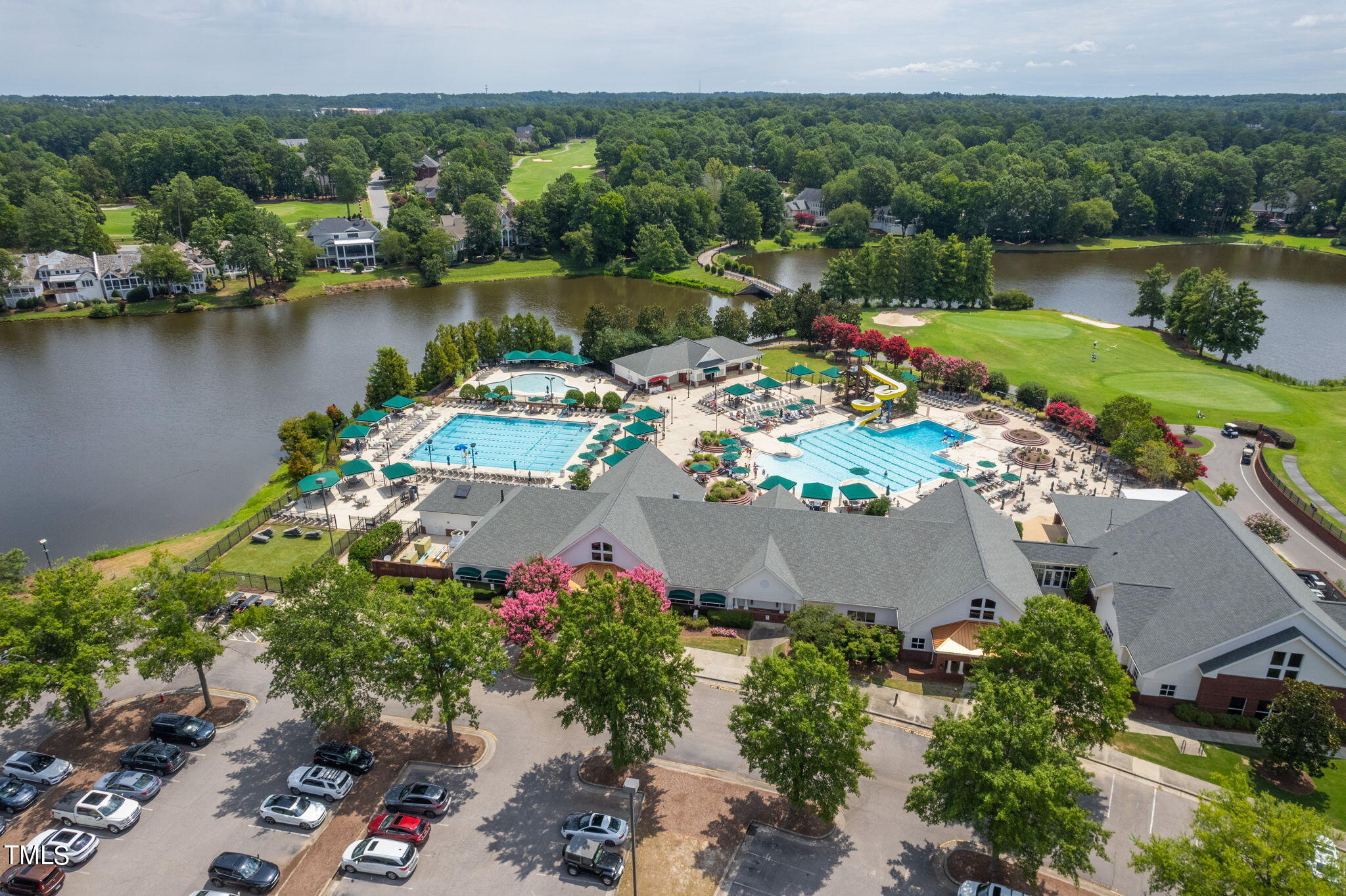 300 Pond Bluff Way Cary, NC 27513 - Photo 69 of 73 an aerial view of a house with a garden and lake view