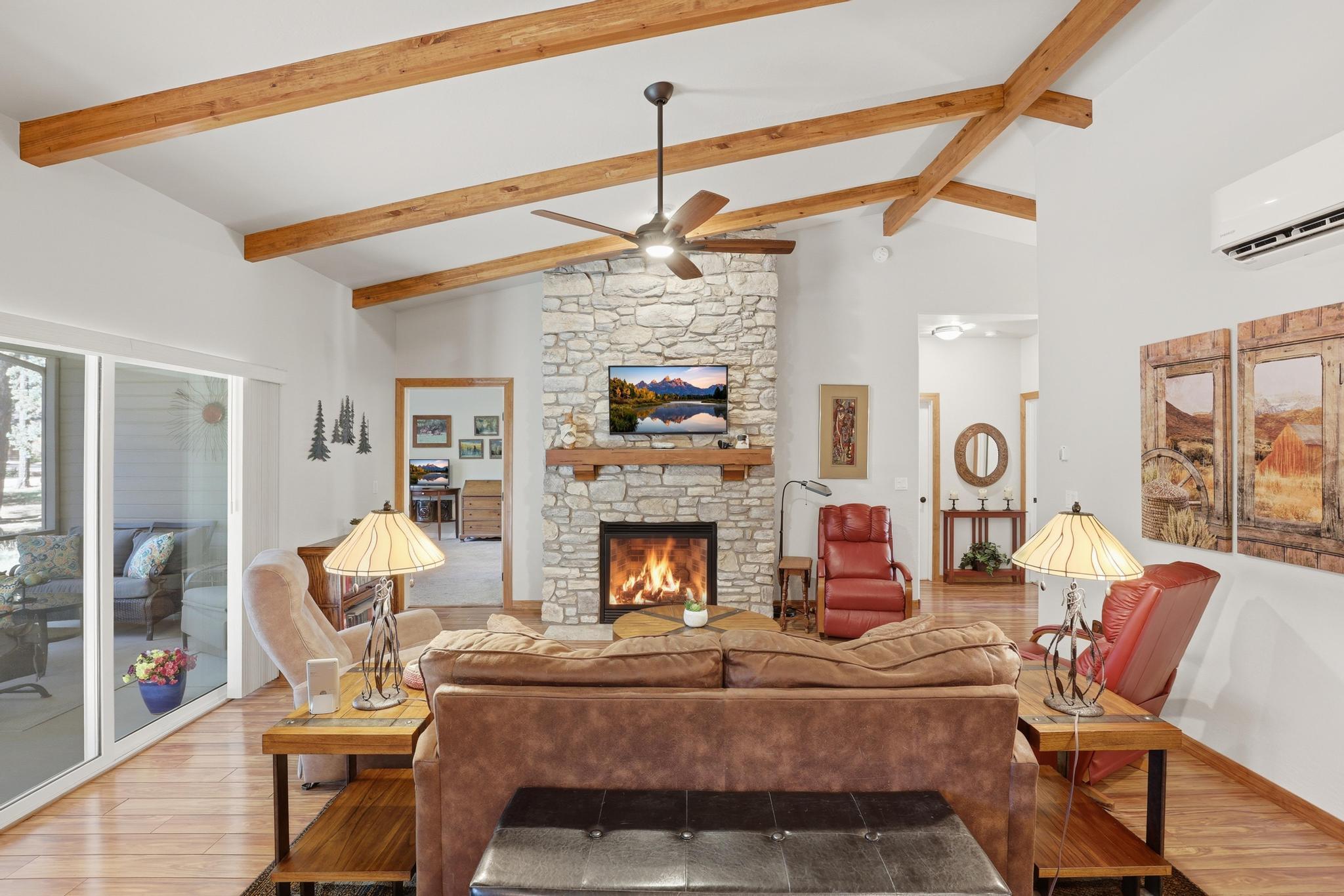 5501 Solitude Trail Loop Pine, AZ 85544 - Photo 10 of 27 a living room with furniture and a fireplace