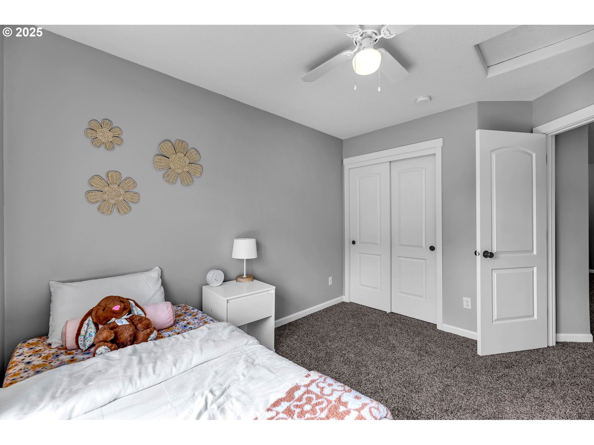 217 North 33rd Court Ridgefield, WA 98642 - Photo 18 of 35 a bedroom with a bed and a chandelier