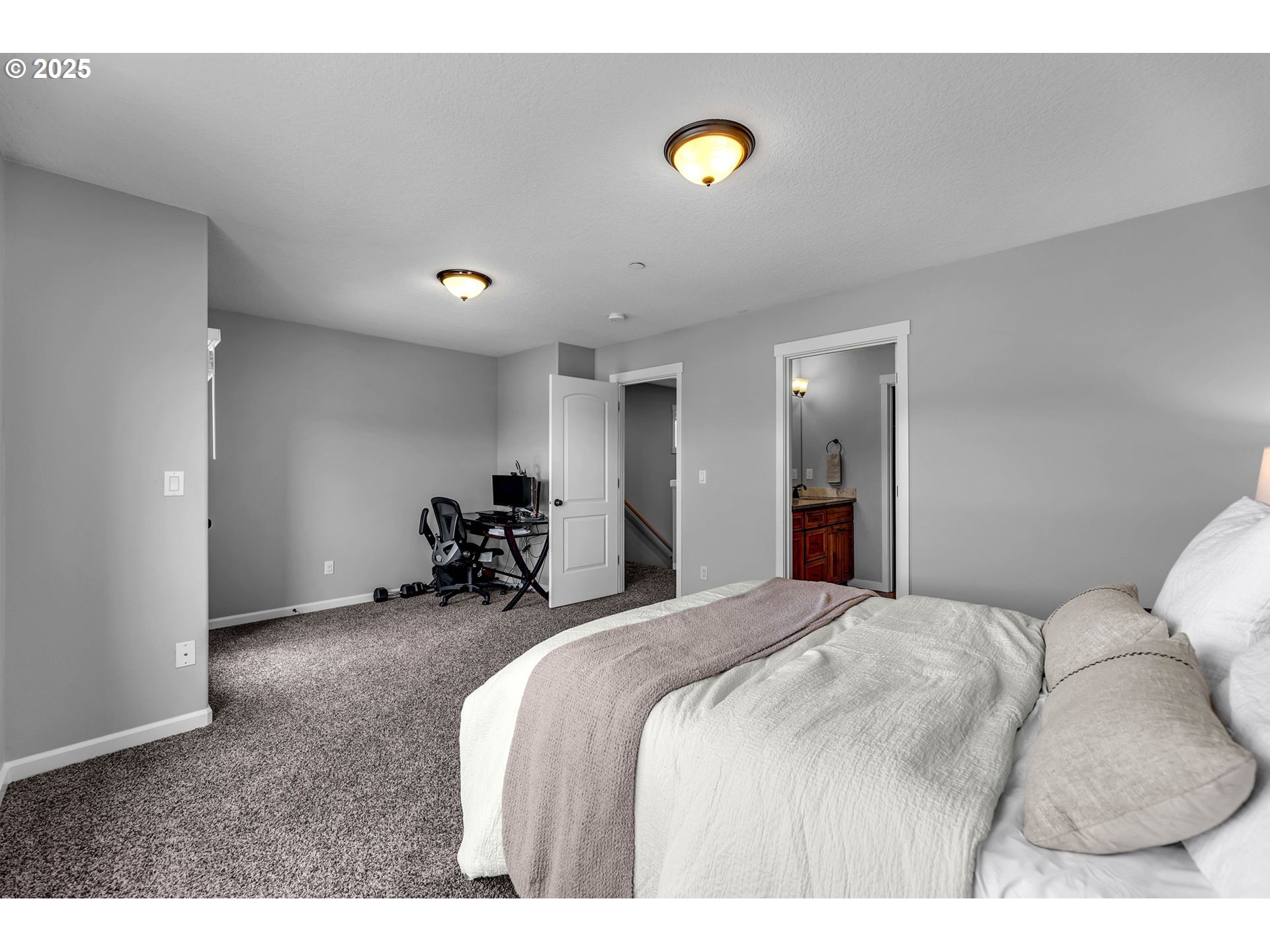 217 North 33rd Court Ridgefield, WA 98642 - Photo 22 of 35 a bed room with a bed and a chair