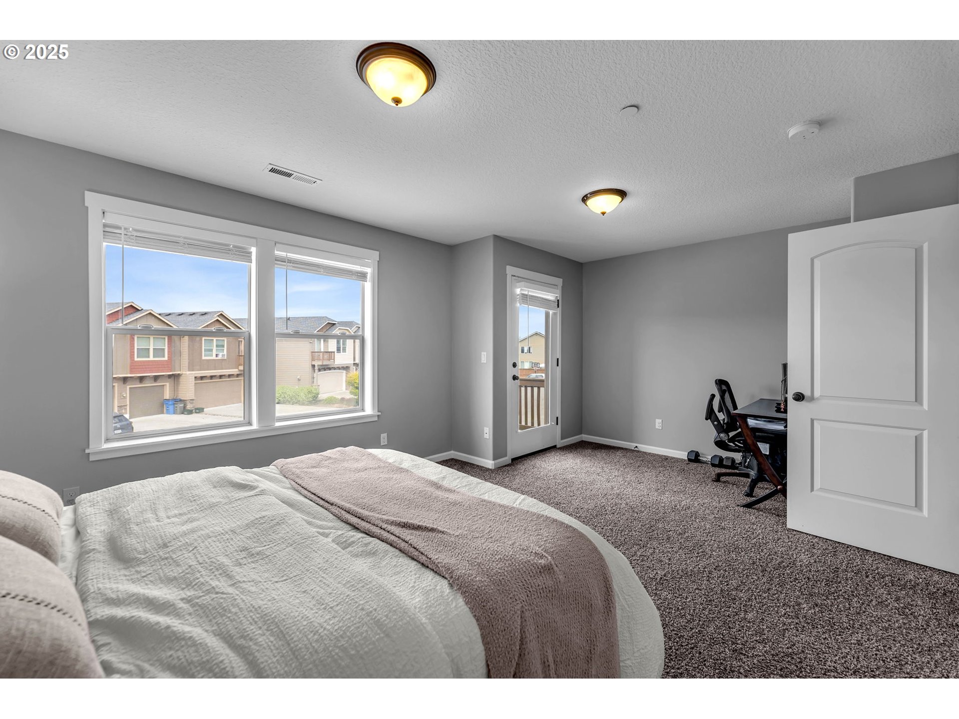 217 North 33rd Court Ridgefield, WA 98642 - Photo 24 of 35 a bedroom with a bed and a window