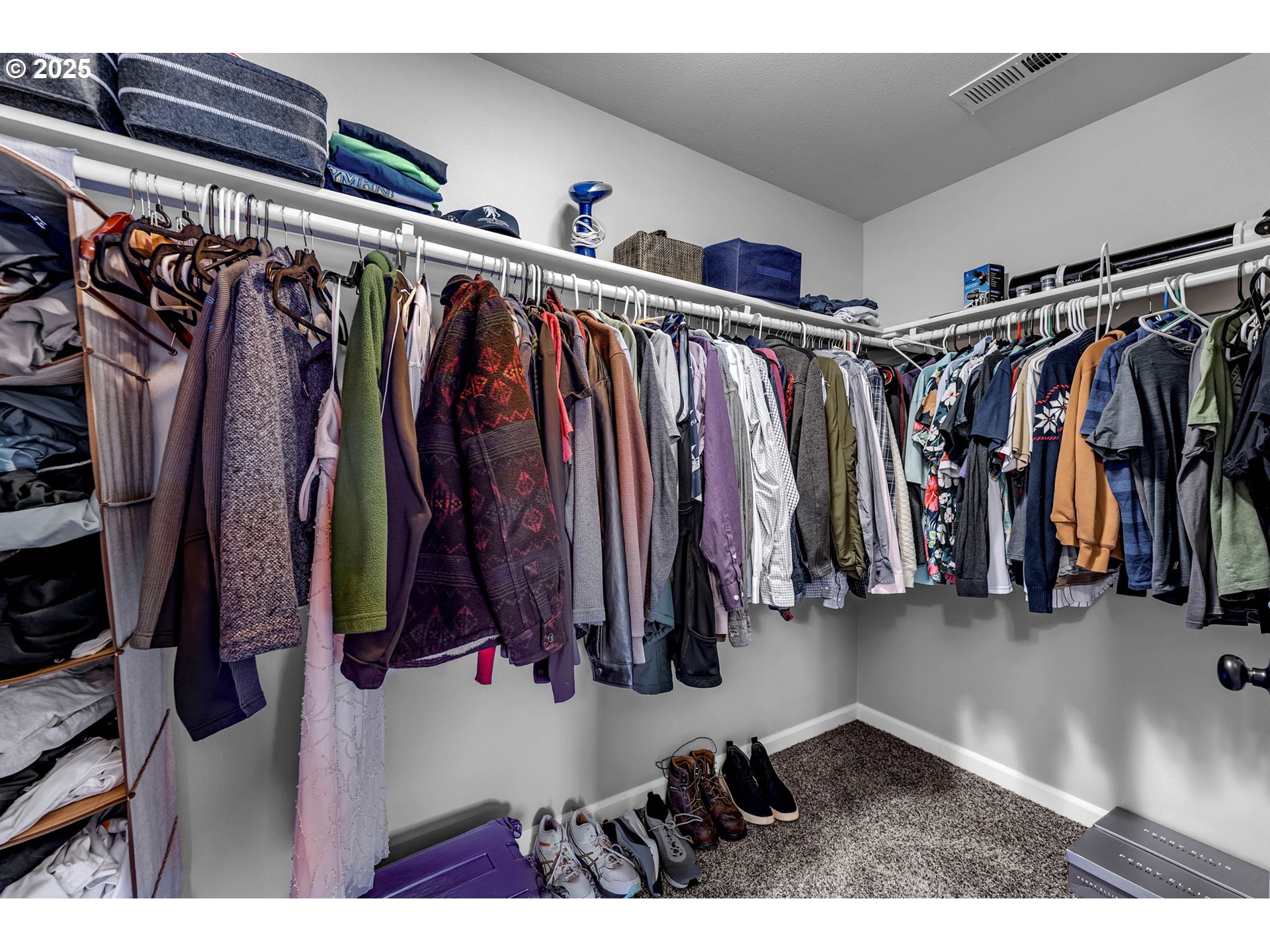 217 North 33rd Court Ridgefield, WA 98642 - Photo 26 of 35 a view of walk in closet with clothes