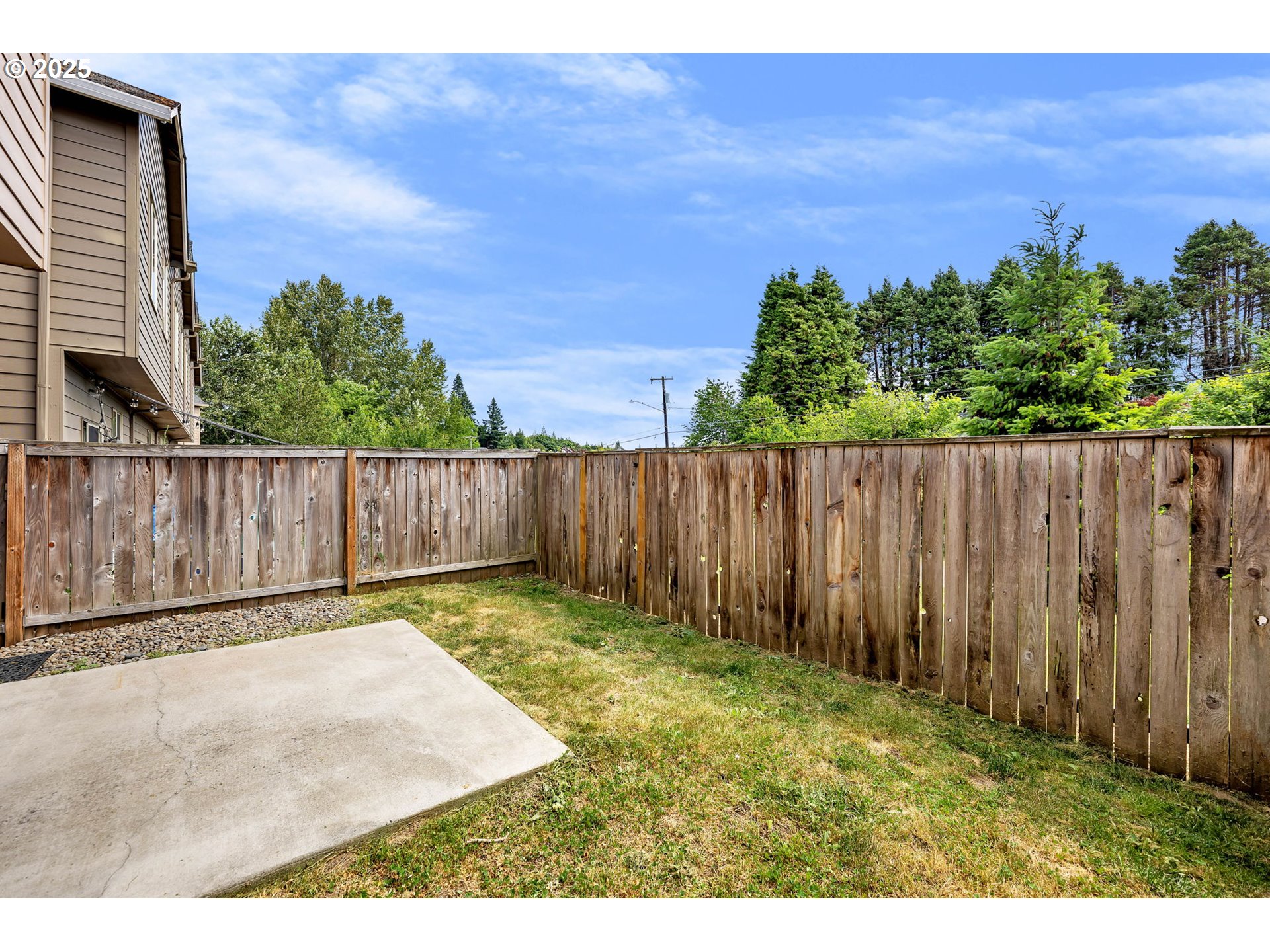 217 North 33rd Court Ridgefield, WA 98642 - Photo 35 of 35 a view of a backyard with wooden fence