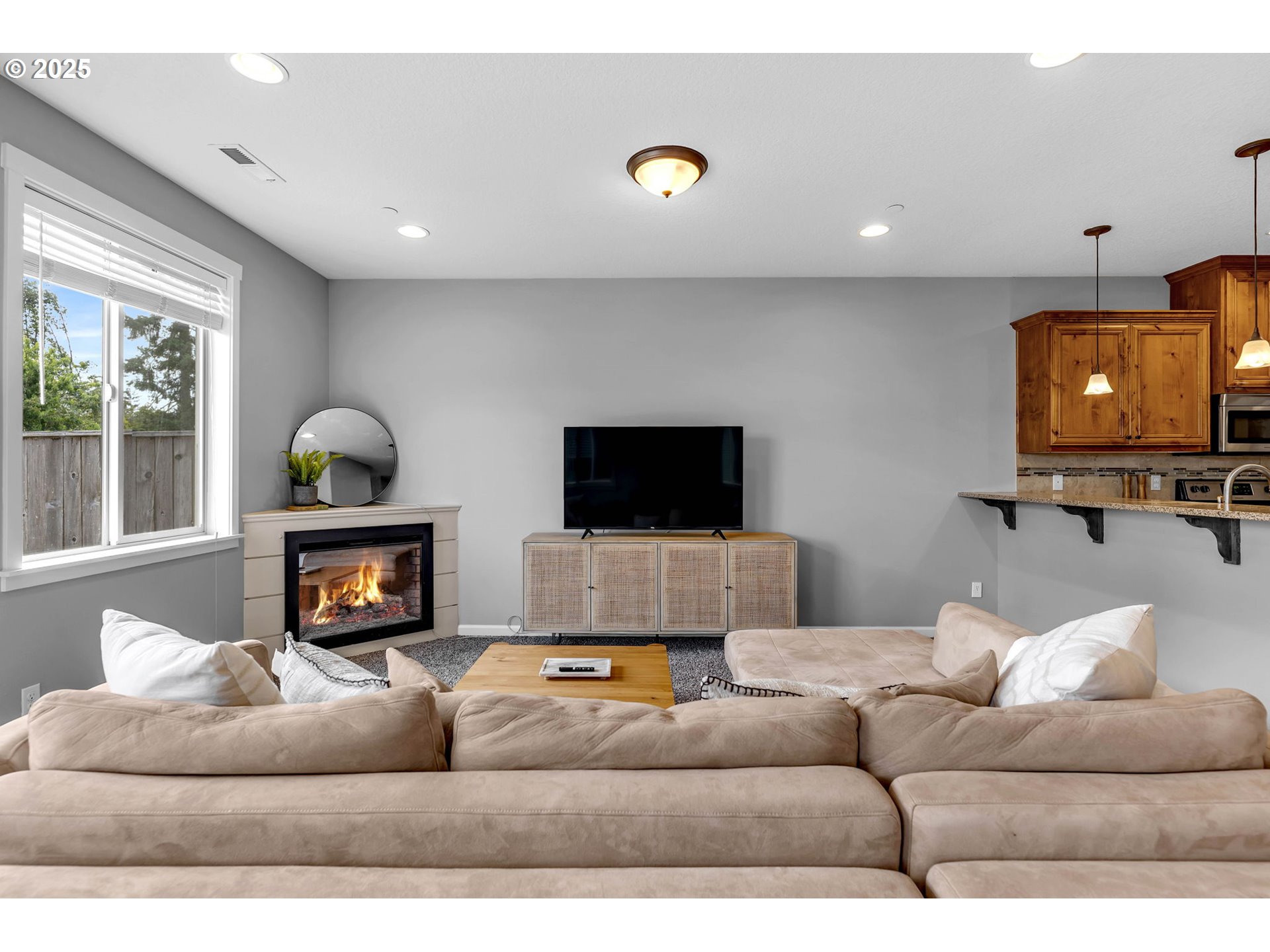 217 North 33rd Court Ridgefield, WA 98642 - Photo 5 of 35 a living room with furniture and a flat screen tv