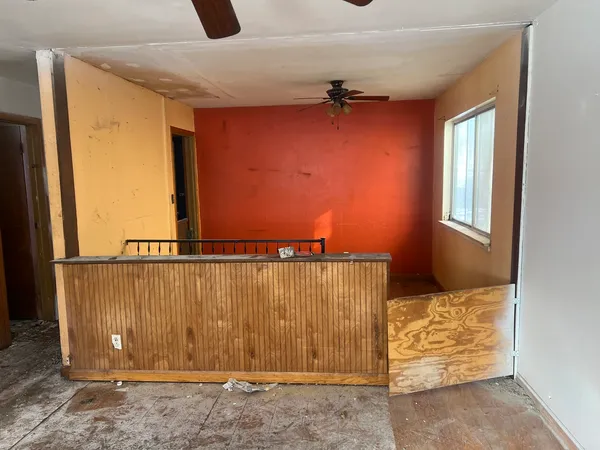 a stove top oven sitting inside of a kitchen