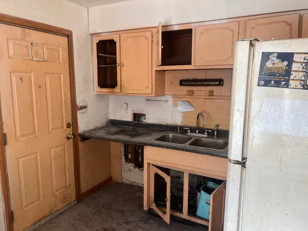 a bathroom with a sink a toilet and bathtub