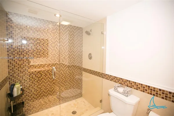 a en suite bathroom with a sink and a mirror
