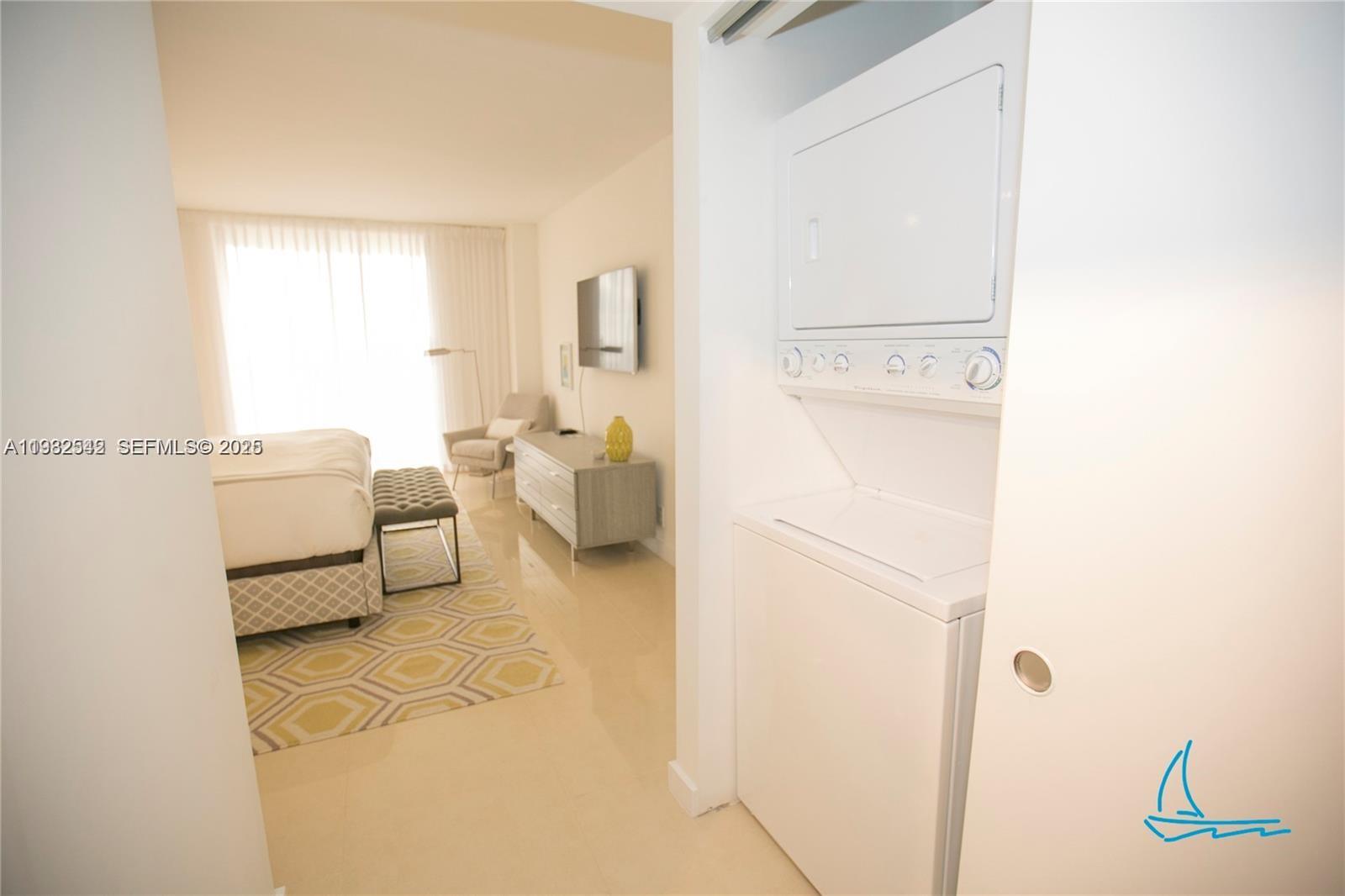 8877 Collins Avenue, Unit 805 Surfside, FL 33154 - Photo 19 of 30 a en suite bathroom with a sink and a mirror