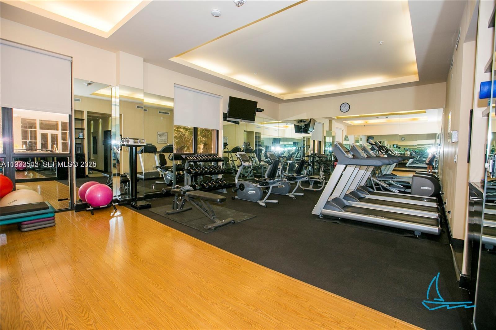 8877 Collins Avenue, Unit 805 Surfside, FL 33154 - Photo 28 of 30 a view of a room with gym equipment