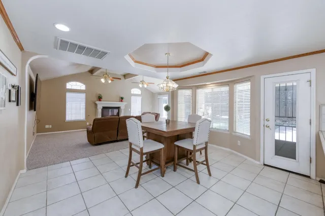 a kitchen with stainless steel appliances kitchen island granite countertop a sink and cabinets