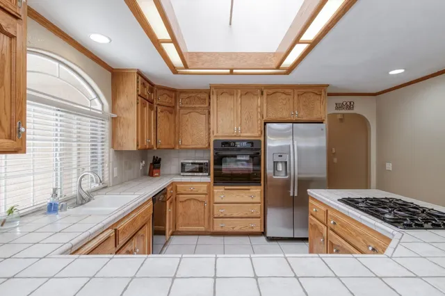 a dining room with furniture a livingroom and chandelier