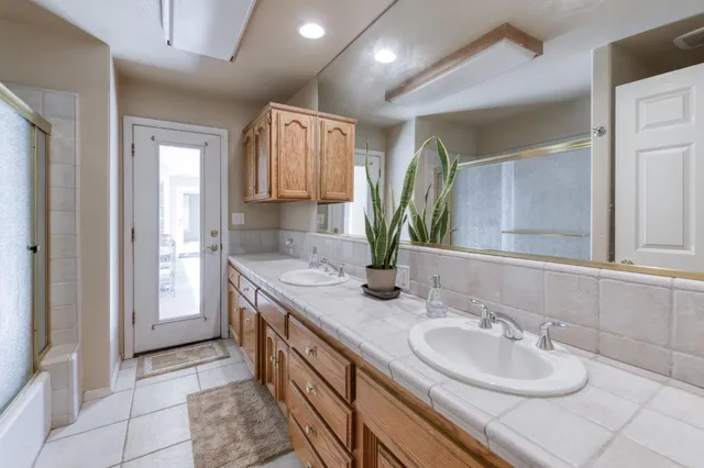 a utility room with a sink a washer and dryer