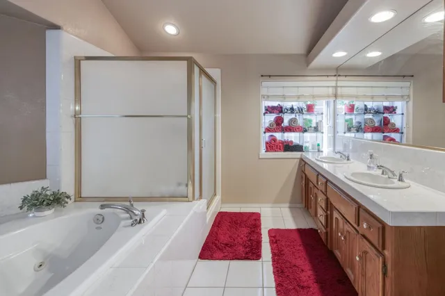 a bathroom with a bathtub and a shower
