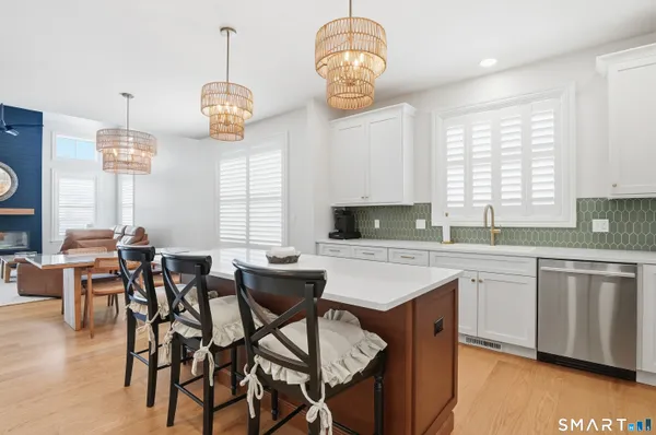 an open kitchen with a table and chairs in it