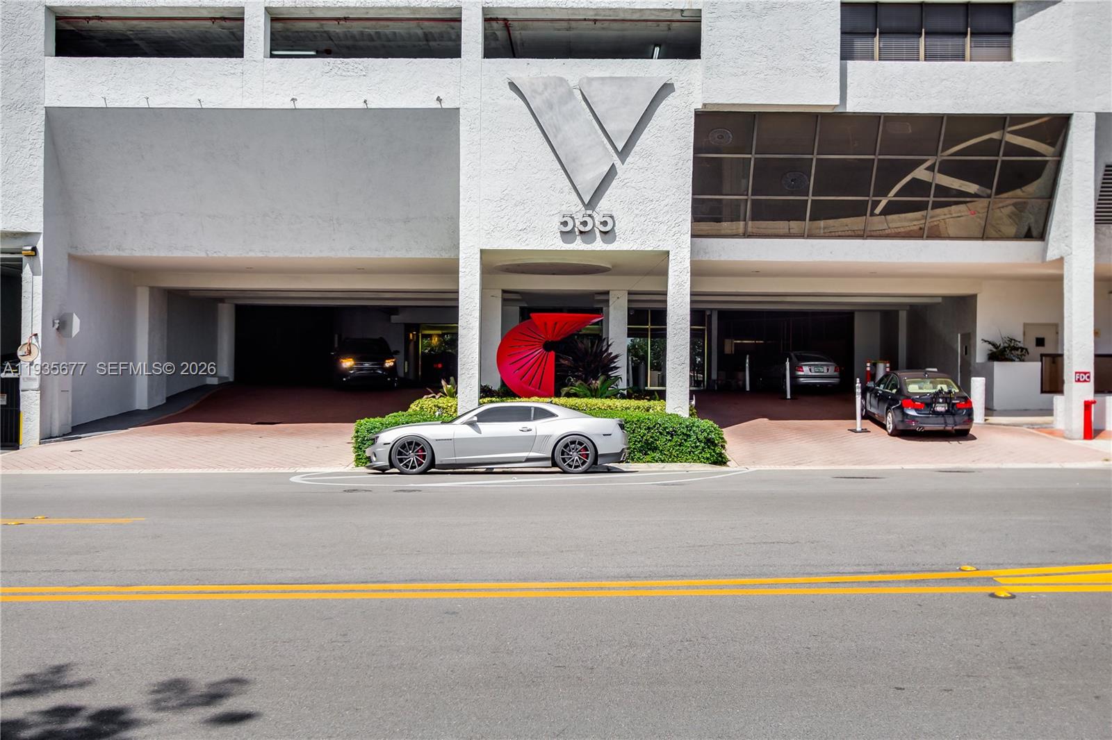 555 Northeast 15th Street, Unit 30H Miami, FL 33132 - Photo 29 of 39 a view of a cars park in front of the building