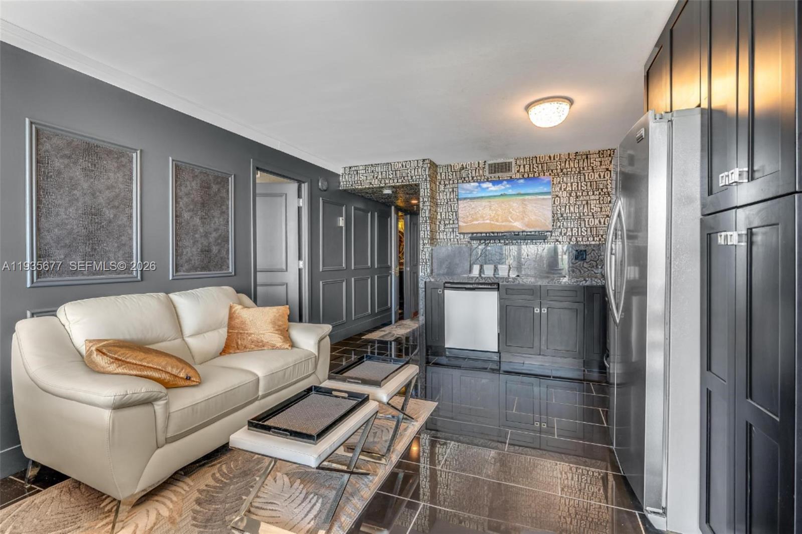 555 Northeast 15th Street, Unit 30H Miami, FL 33132 - Photo 7 of 39 a living room with furniture and a large window