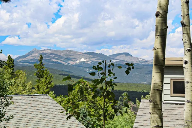 a view of a chair and tables back yard of the house
