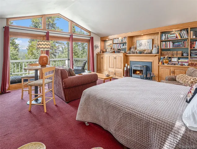 a kitchen with furniture and a stove