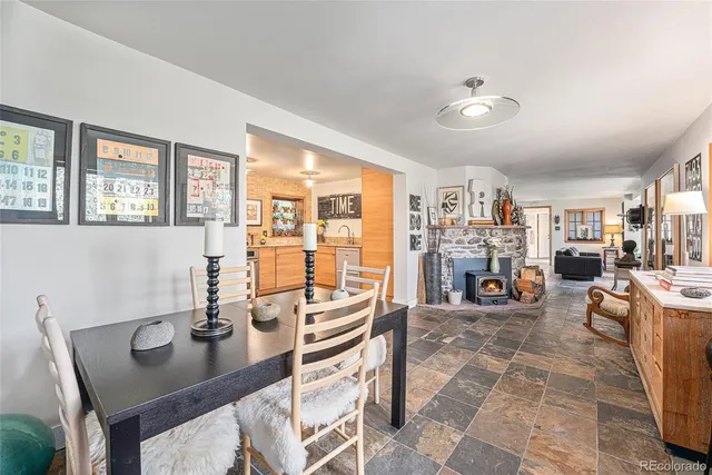 a view of a patio with table and chairs under an umbrella