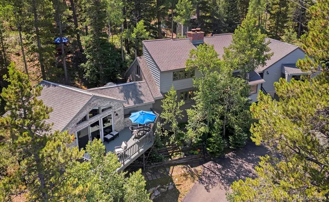 a view of a livingroom with workspace and a window
