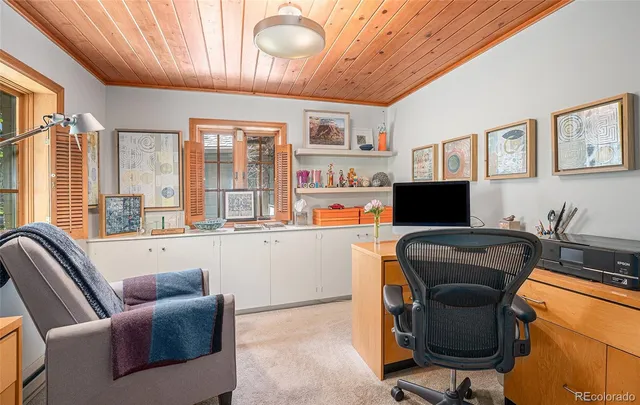 a bed room with a bed and a large window