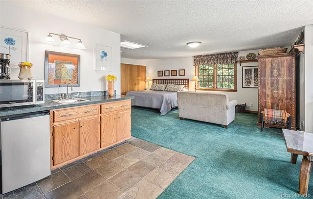 a bedroom with bed and a window