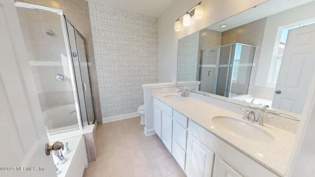 a bathroom with a double vanity sink and a mirror