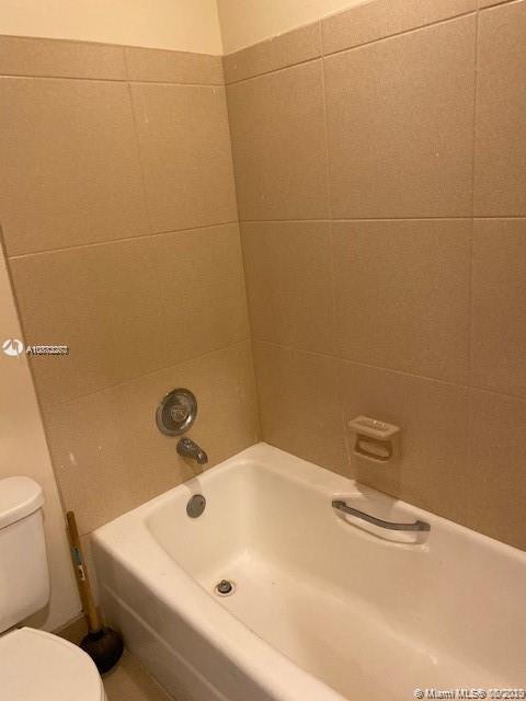 3448 Spring Bluff Place, Unit 27 Lauderhill, FL 33319 - Photo 18 of 24 a bathroom with a sink and toilet