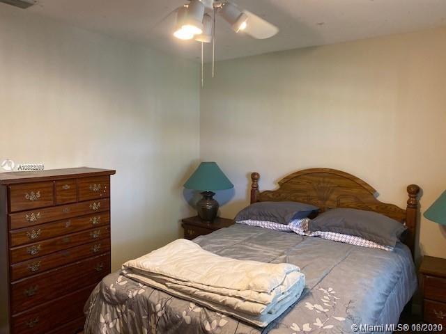 3448 Spring Bluff Place, Unit 27 Lauderhill, FL 33319 - Photo 19 of 24 a bedroom with a bed and a closet
