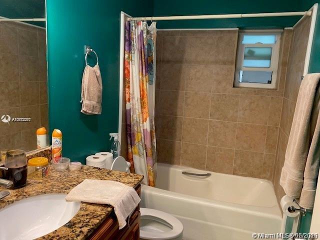 3448 Spring Bluff Place, Unit 27 Lauderhill, FL 33319 - Photo 20 of 24 a bathroom with a sink and a mirror