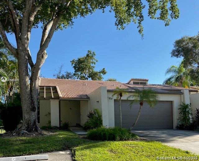 3448 Spring Bluff Place, Unit 27 Lauderhill, FL 33319 - Photo 2 of 24 front view of a house with a yard