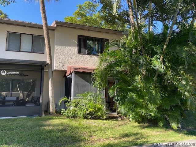 3448 Spring Bluff Place, Unit 27 Lauderhill, FL 33319 - Photo 21 of 24 a view of a house with a yard