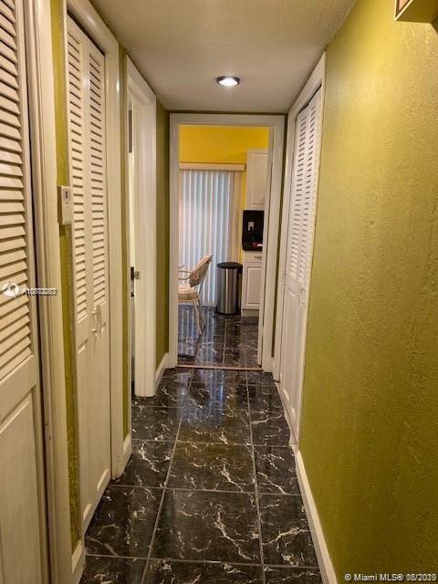 3448 Spring Bluff Place, Unit 27 Lauderhill, FL 33319 - Photo 7 of 24 a view of a bathroom with a glass door