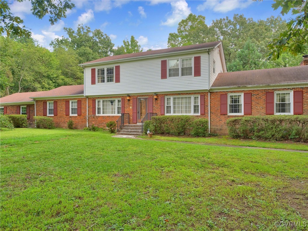8901 Strath Road Henrico, VA 23231 - Photo 15 of 47 View of front of home featuring a front lawn